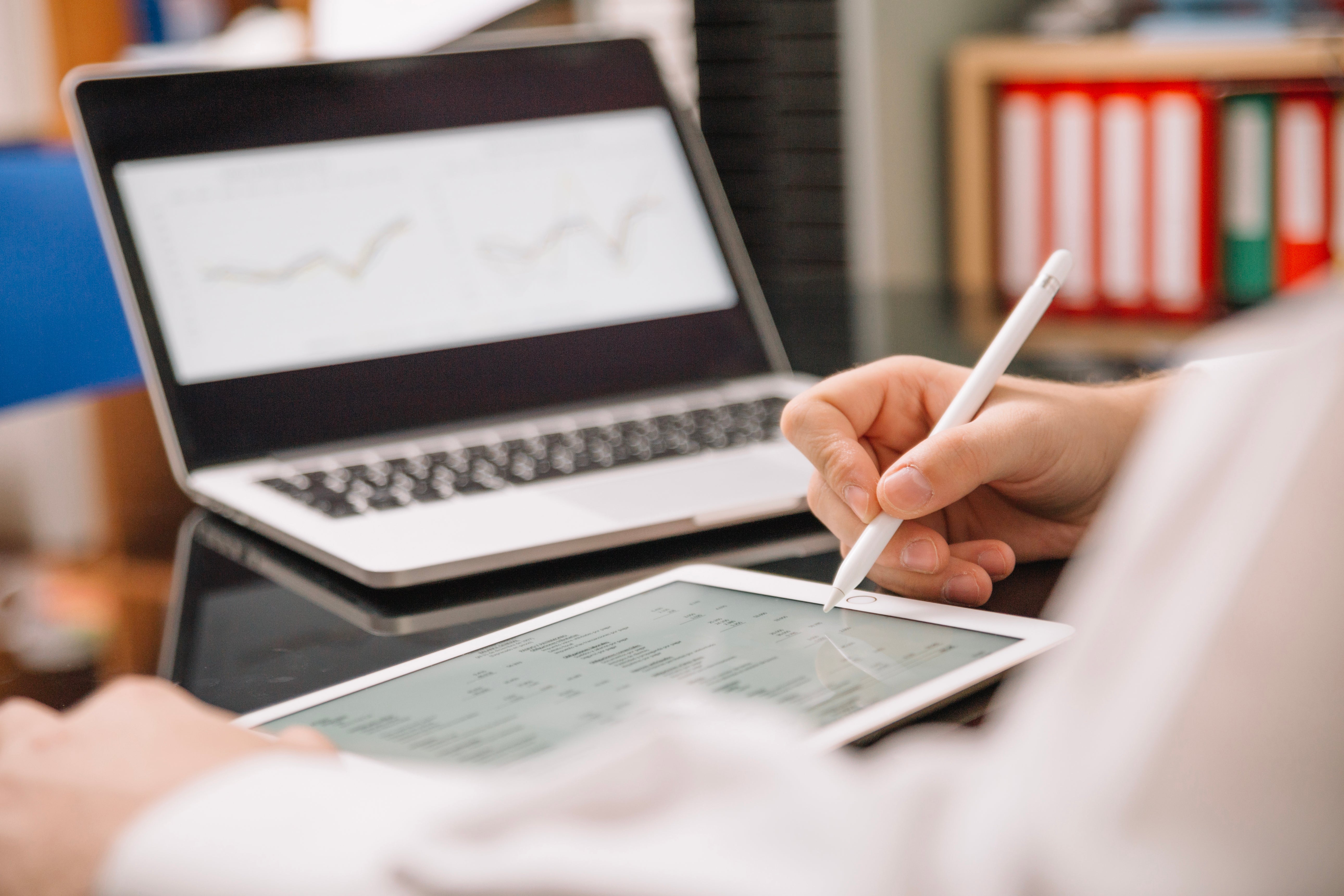 An employee tracking the data and revenue of an eSIM business.